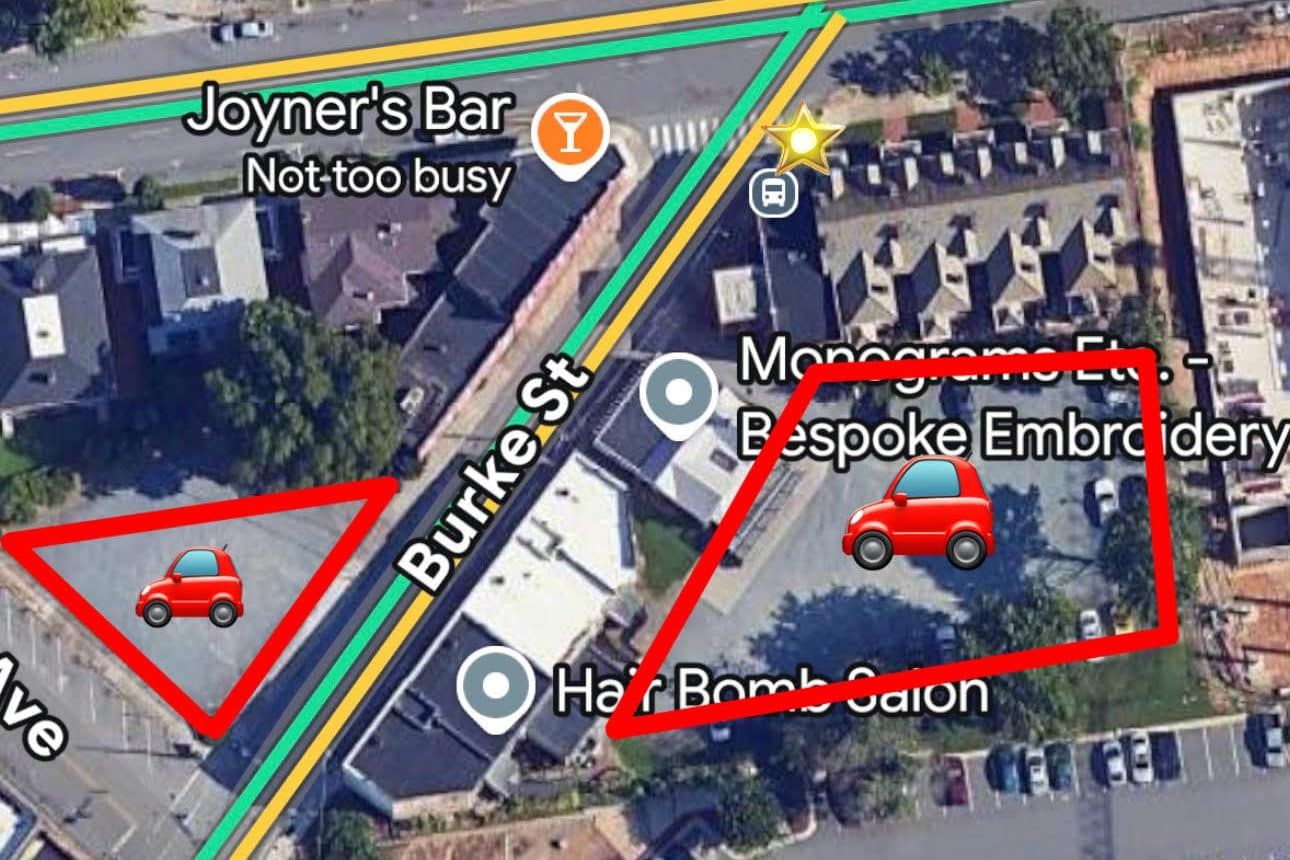 The parking lot beside Black Oak Barbershop on Burke Street